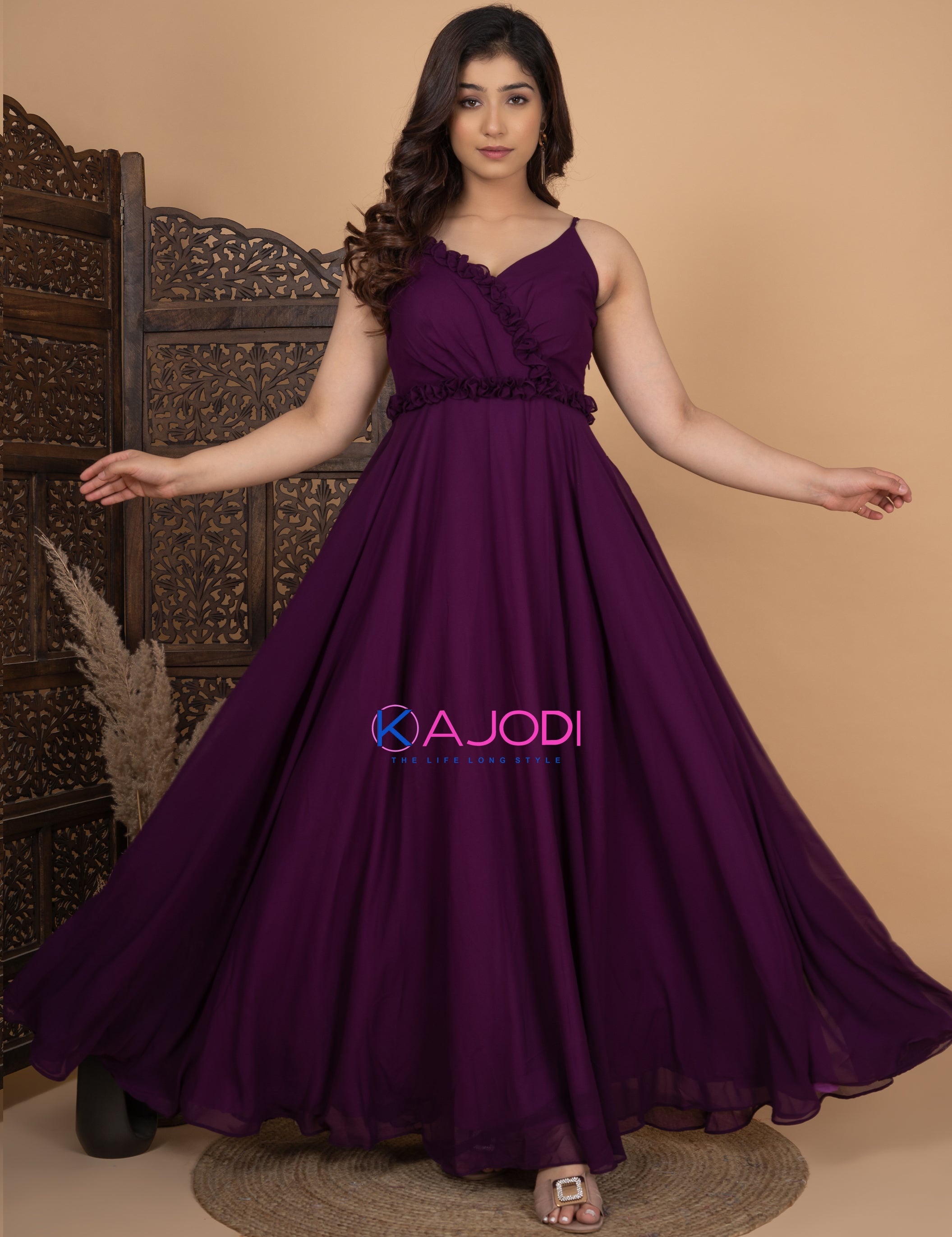 purple long gown in silk blend with gold thread embroidery and mirror work  on the neckline . Has a unique designer back.